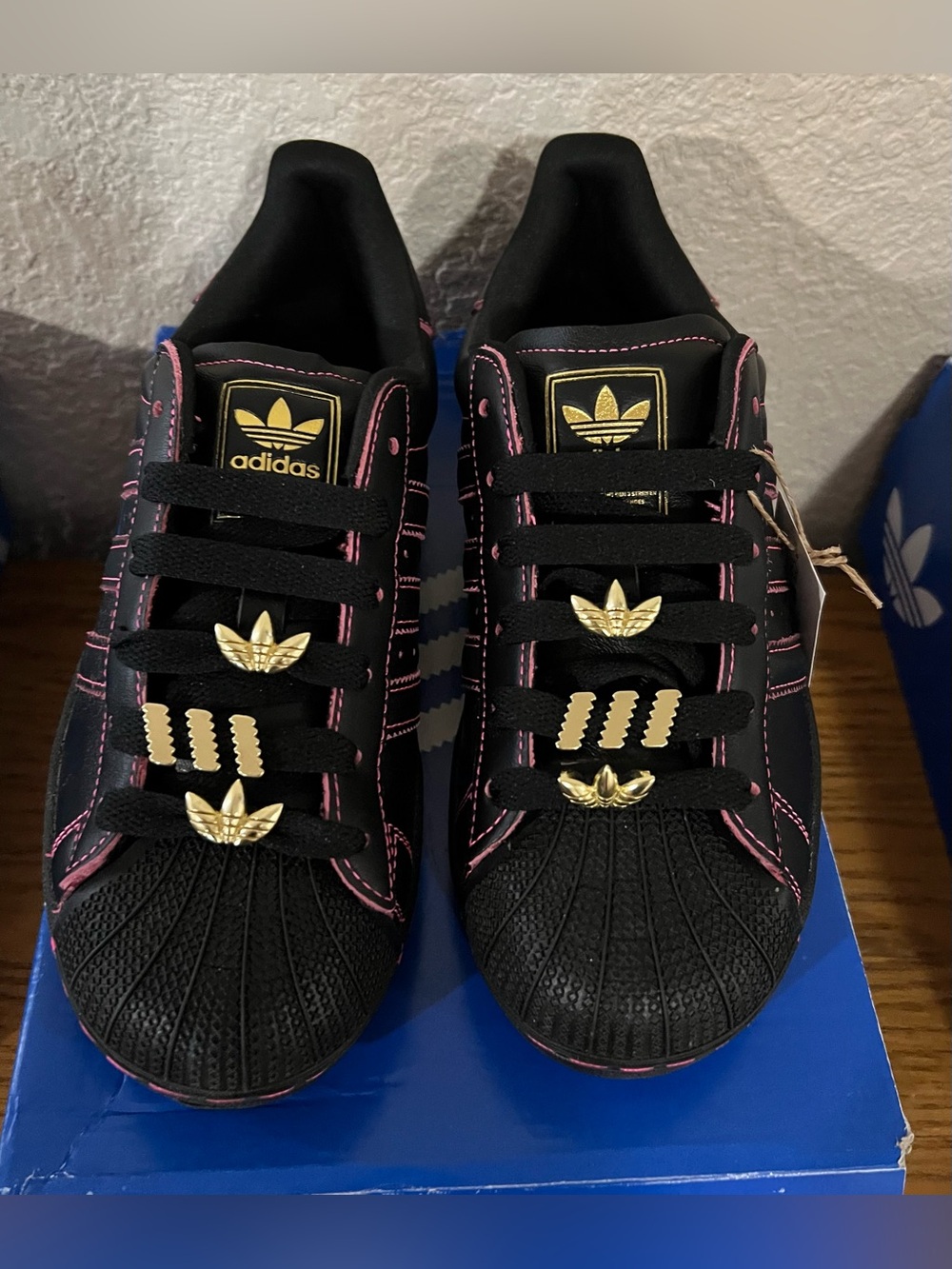adidas Women's Black Sneaker with Pink Stitching & Gold Accents